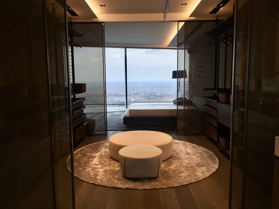 Dressing room opening into a bedroom with city views at the four-storey residence in Budapest.