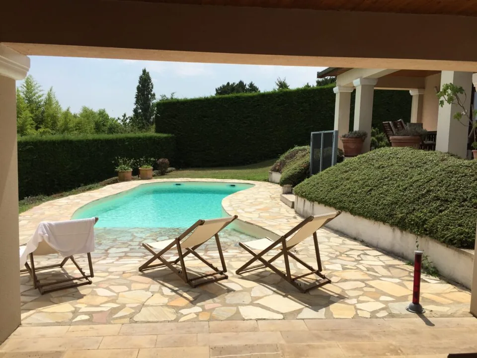 Sheltered terrace and swimming pool at the summer residence near Lyon.